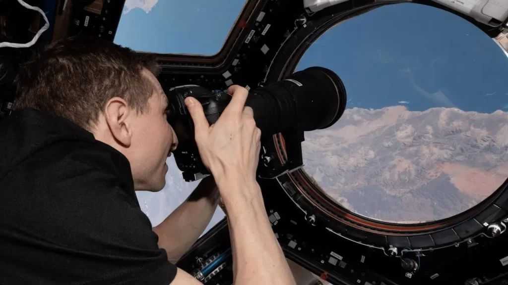 NASA astronaut photographing the Earth. 